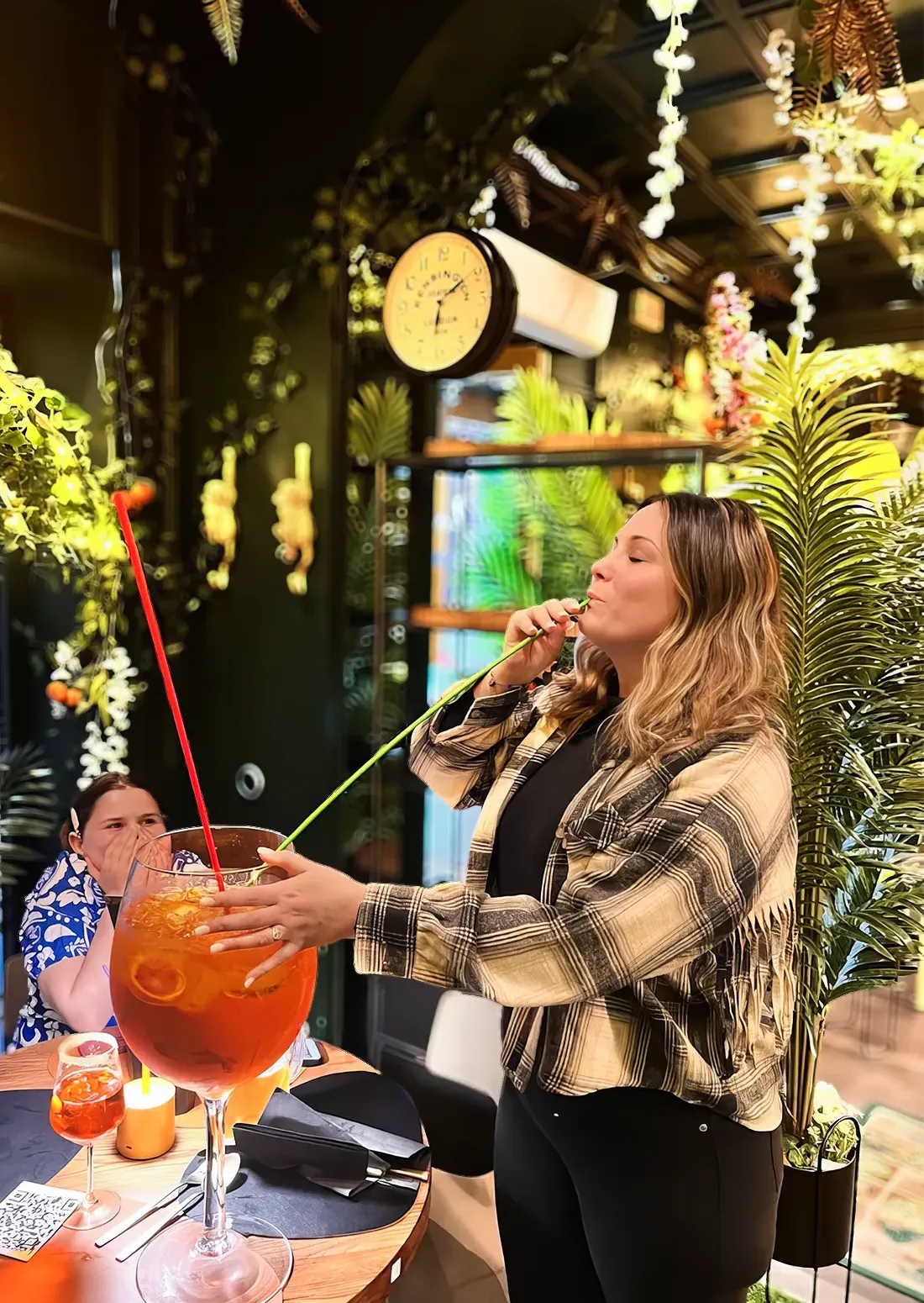 girl enjoying a maxi aperol spritz in venice